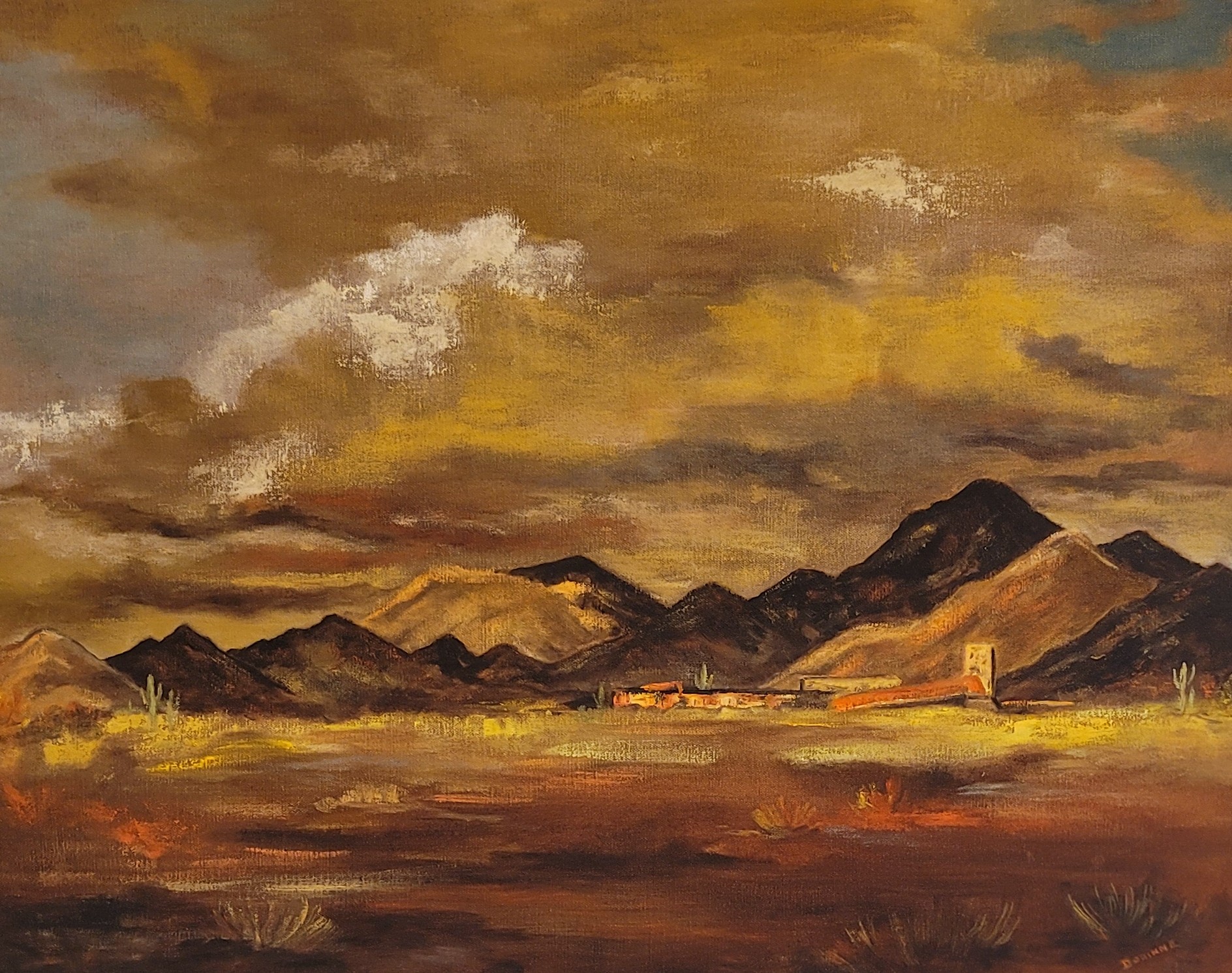 Tallesin West by Dorinne Armstrong. A warm, orangey-brown acrylic painting of a desert landscape with a small city/house, backed by mountains and dramatic clouds.
